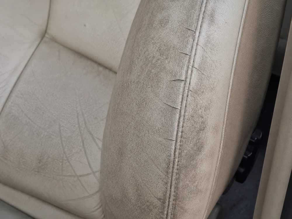 Leather car seat dull, grimy and cracking