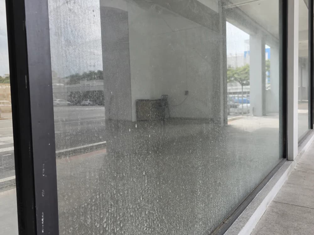 Storefront glass — road grime and water spots