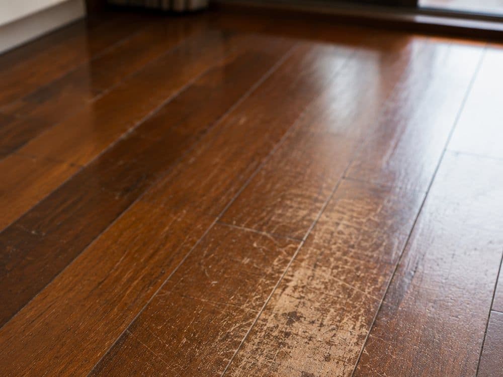 Scratched, worn hardwood floor