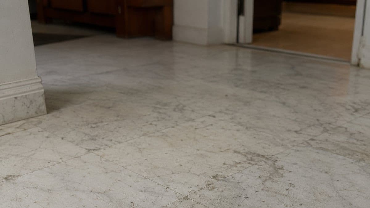 Dull marble lobby floor before cleaning