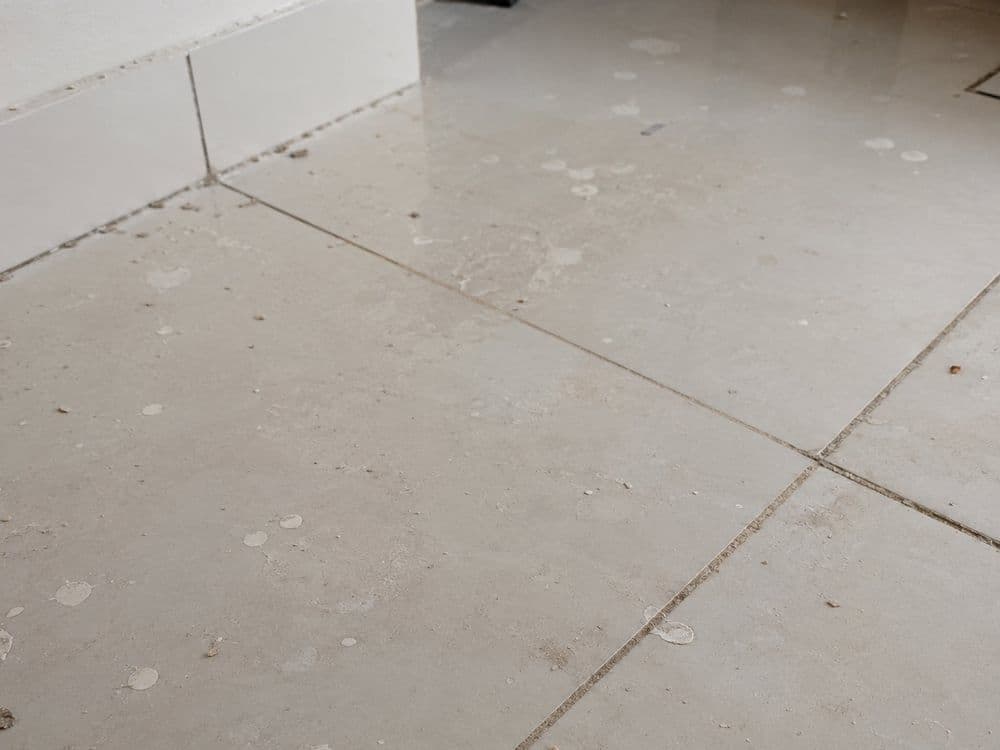 Tile flooring with dried paint splatter