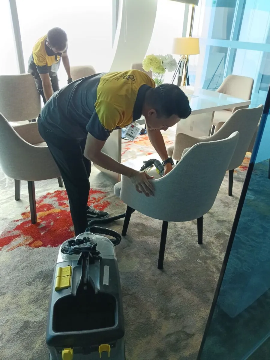 Cleaning lounge chairs at a hotel