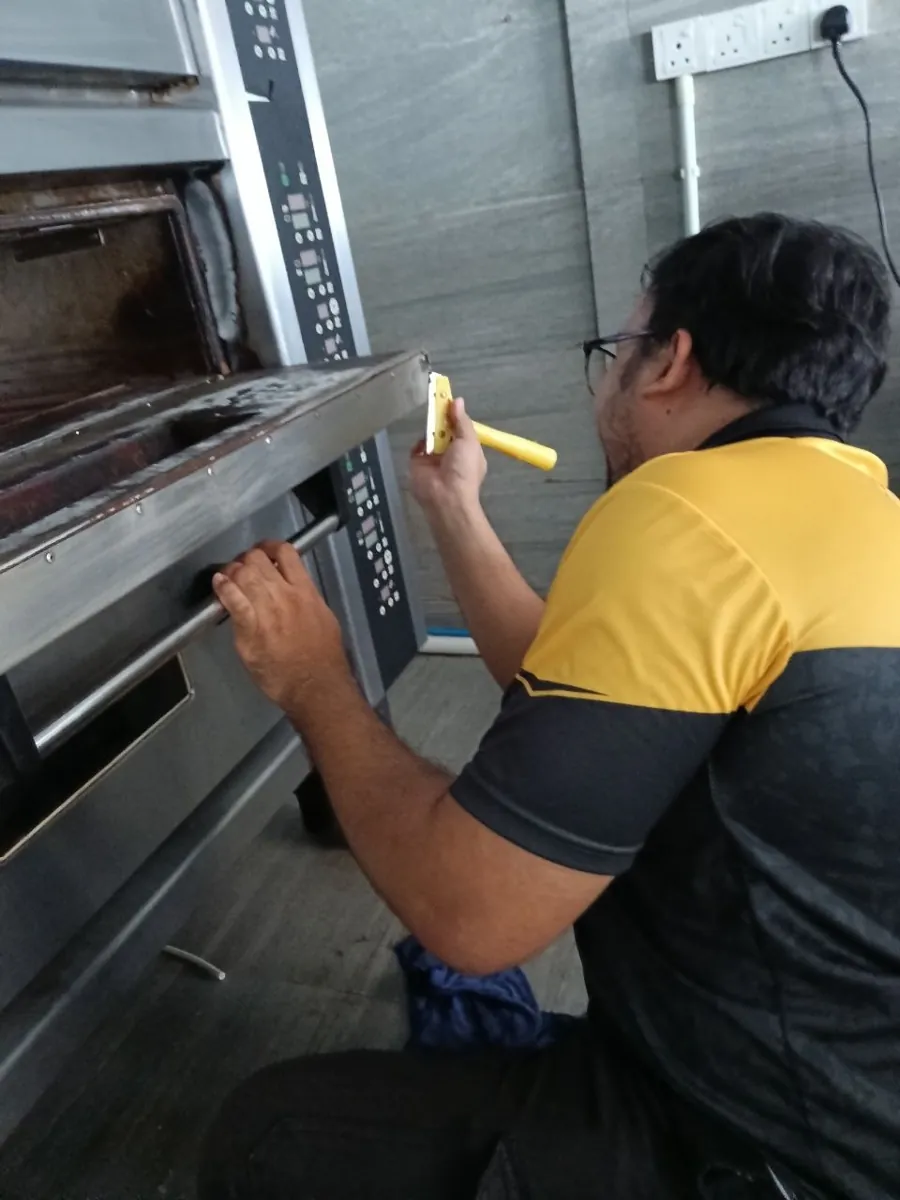 Cleaning a commercial kitchen oven