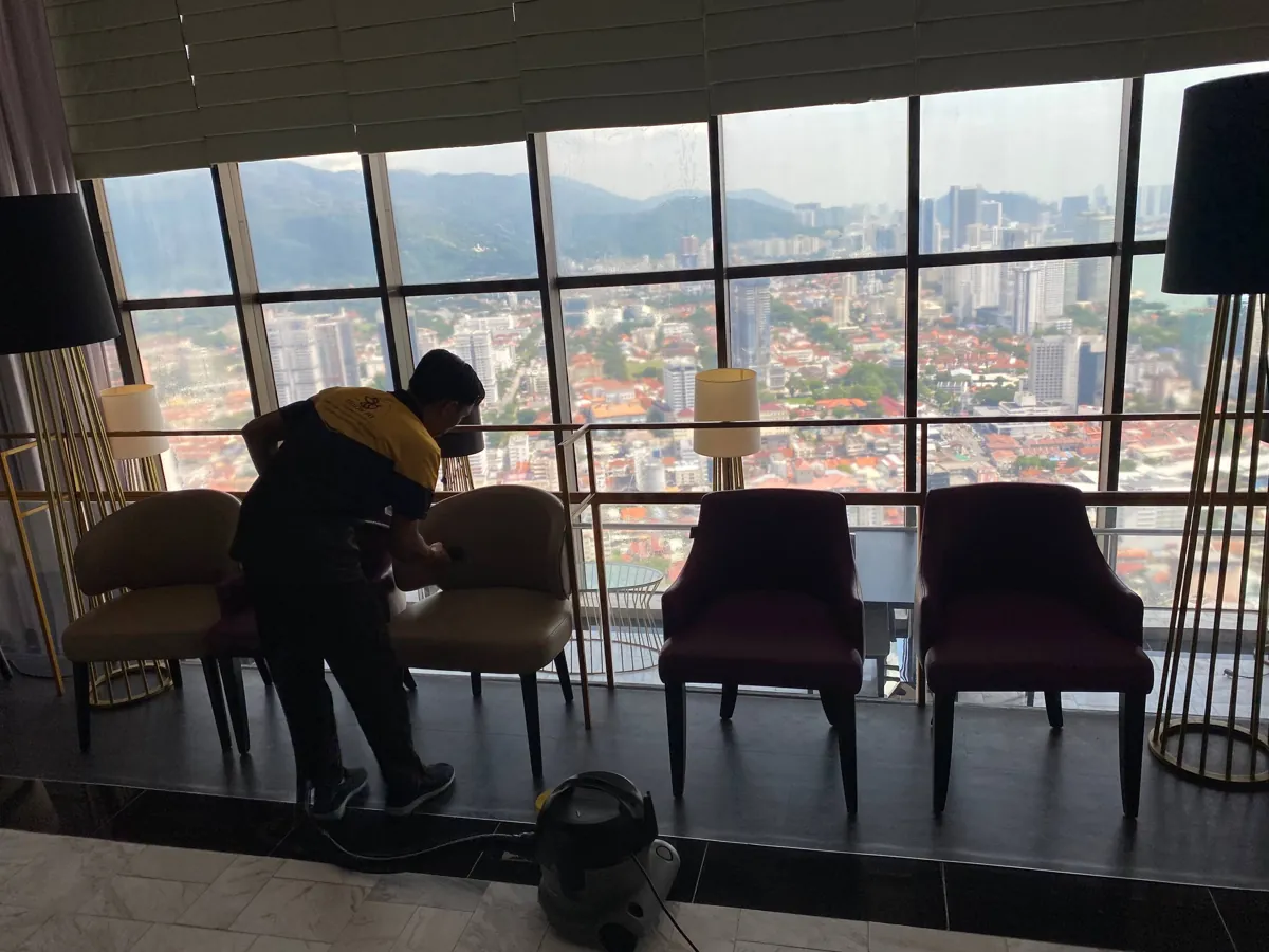 Cleaning seating at a restaurant lounge