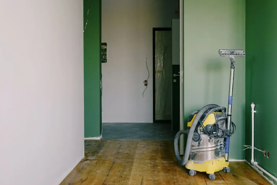 Industrial vacuum ready for dust removal inside a renovated room