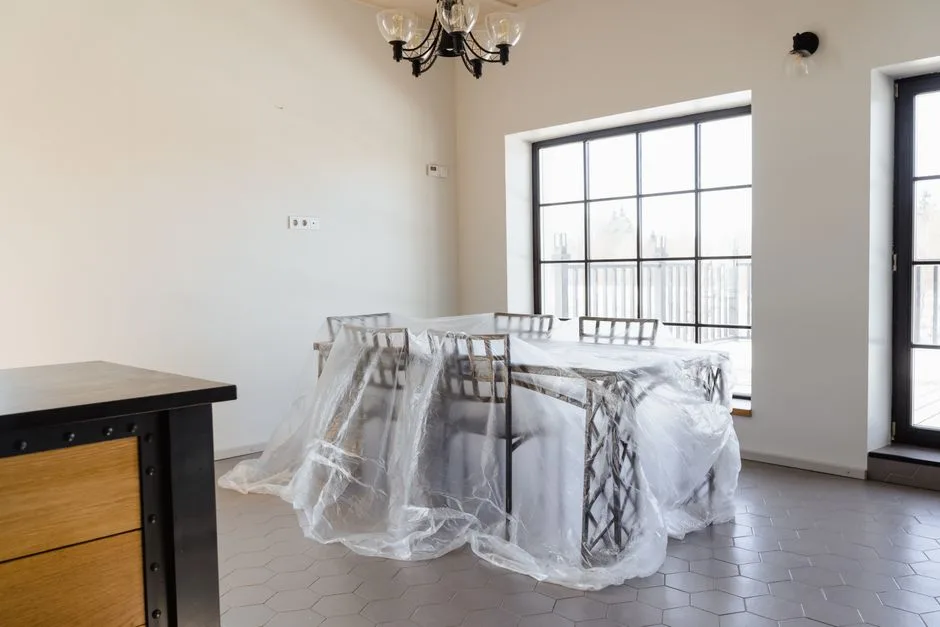 Dining furniture covered and protected while renovation work is being completed