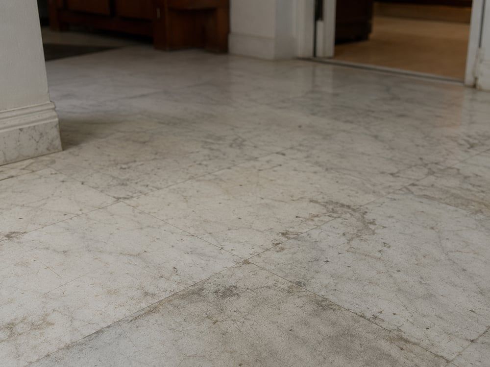 Dull, stained marble floor